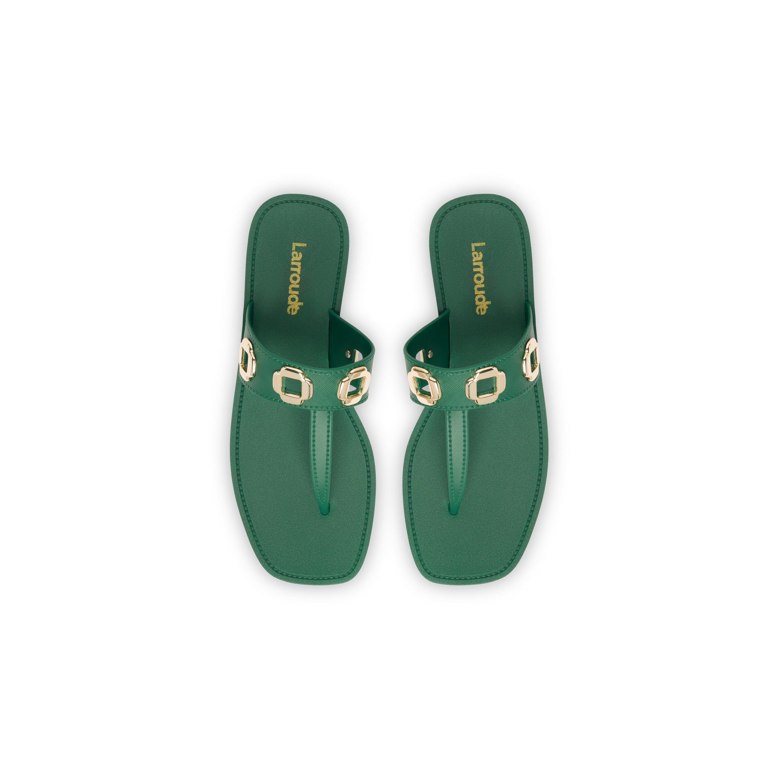 These Milan S sandals in Emerald PVC boast a minimalist square-toe design, featuring green thong straps adorned with rectangular gold-tone buckle details. The insole, emblazoned with the "Larroude" brand name in gold lettering, signifies their status as a Larroudé bestseller, making them ideal for any outing.