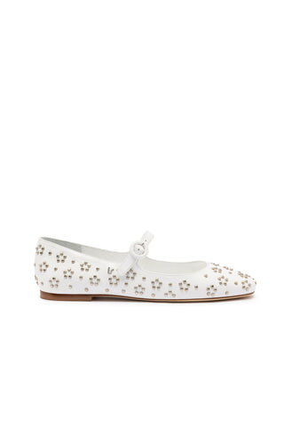 The Blair Ballet Flat in white leather and metallic studs is a Mary Jane-style shoe adorned with small silver studs on the toe and heel areas. It features a rounded toe, a single strap with a round buckle, and a low wooden heel. The shoe is displayed against a plain white background.