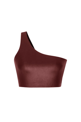 Introducing the Liquid Curve Bra - Cherry: a sleek, dark brown asymmetrical single shoulder crop top with a smooth, satin-like texture. It features a supportive strap on the left side, creating an elegant and modern look.