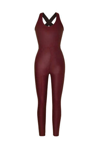 Dark red, full-bodied Vixen Jumpsuit - Cherry with a fitted design, slim legs, and cross-over straps at the back; made of liquid shine fabric for that extra flair.