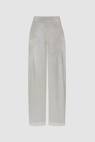 The Alba Sequin Pant - Pearl features light grey, high-waisted, wide-leg pants with a shimmering texture and subtle sequin sparkle, displayed on a plain white background. Ideal for resorts and vacations.