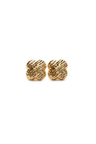 A close-up of Ariana Earrings in textured gold, showcasing a rounded, wavy design against a white background.