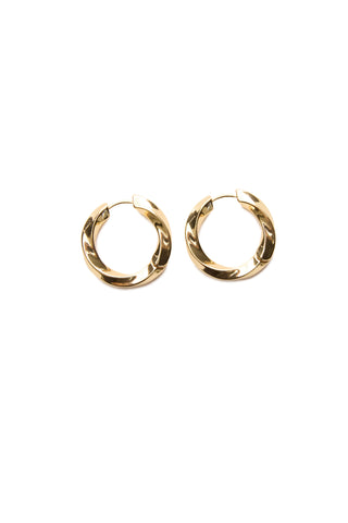 Presenting the Camila Round Hoop - Gold: a pair of gleaming, gold-tone earrings showcased against a white background. These hoops boast a smooth, reflective surface with a subtly twisted design, delivering a modern and elegant appearance.