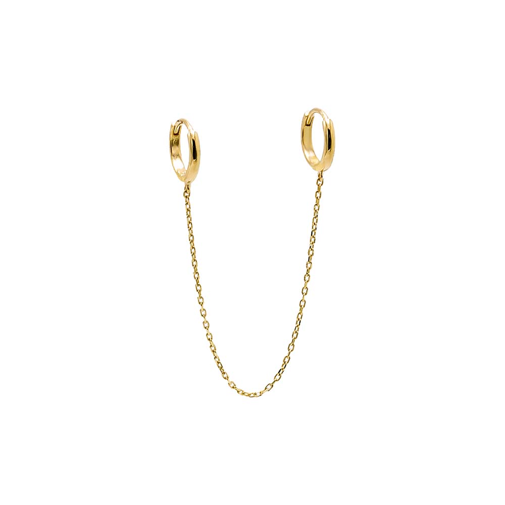 Presenting the Solid Double Chain Huggie Earring 14K by By Adina Eden: a pair of small 14K gold huggie earrings connected by a delicate double chain. The simple, polished hoops attach to either end of the chain, creating an elegant and minimalist design against a plain white background.