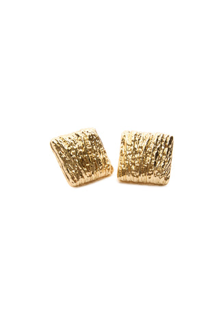 A pair of Lorelai Square Earrings - Gold on a white background. These stunning pieces, part of our exclusive jewelry collection, showcase a rectangular shape adorned with an elegant wave-like pattern.