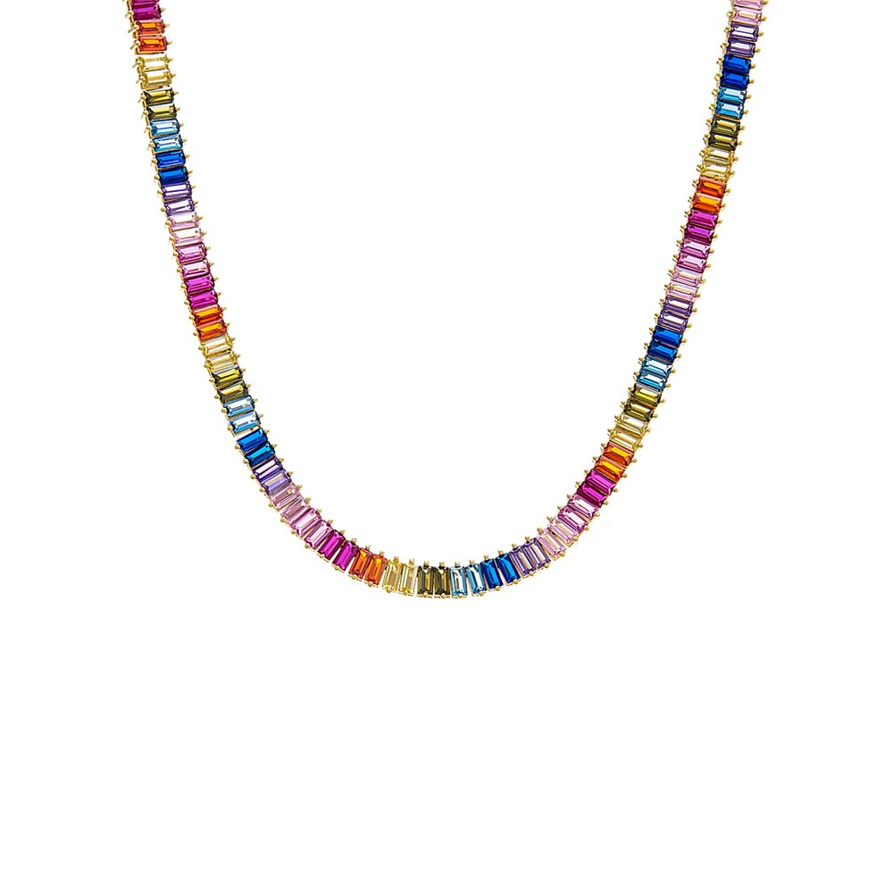The Multi Colored Baguette Tennis Necklace by By Adina Eden features a stunning 14K gold plated design adorned with rectangular multicolored gemstones. Arranged in a repeating pattern, the gemstones display vibrant shades of blue, red, pink, and orange. The necklace forms a complete loop without any visible clasp, highlighting its elegant and eye-catching design.
