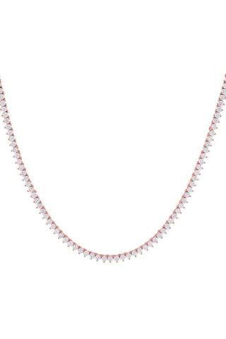 The Three Prong Tennis Necklace by By Adina Eden features a delicate design with small, closely spaced, pear-shaped diamonds elegantly set in a rose gold chain. This minimalist yet elegant piece is perfect for formal occasions and forms a gentle curve that complements the neckline, reminiscent of the classic CZ tennis necklace.