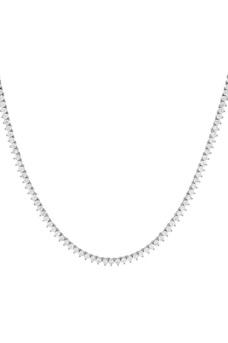 The Three Prong Tennis Necklace by Adina Eden is a delicate sterling silver piece that features a continuous string of small, evenly spaced, round diamonds. It creates an elegant and shimmering effect with its simple yet sophisticated design, making it perfect for adding a touch of sparkle to any outfit.