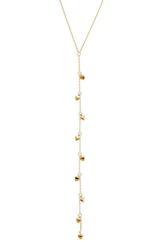 The Solid Puffy Hearts Lariat Necklace 14K by Adina Eden features a delicate Y-shaped design adorned with multiple small, heart-shaped pendants evenly spaced along the chain. Its drop length adds an elegant touch, making it perfect for both casual and formal occasions. An extender allows for adjustable wearability.