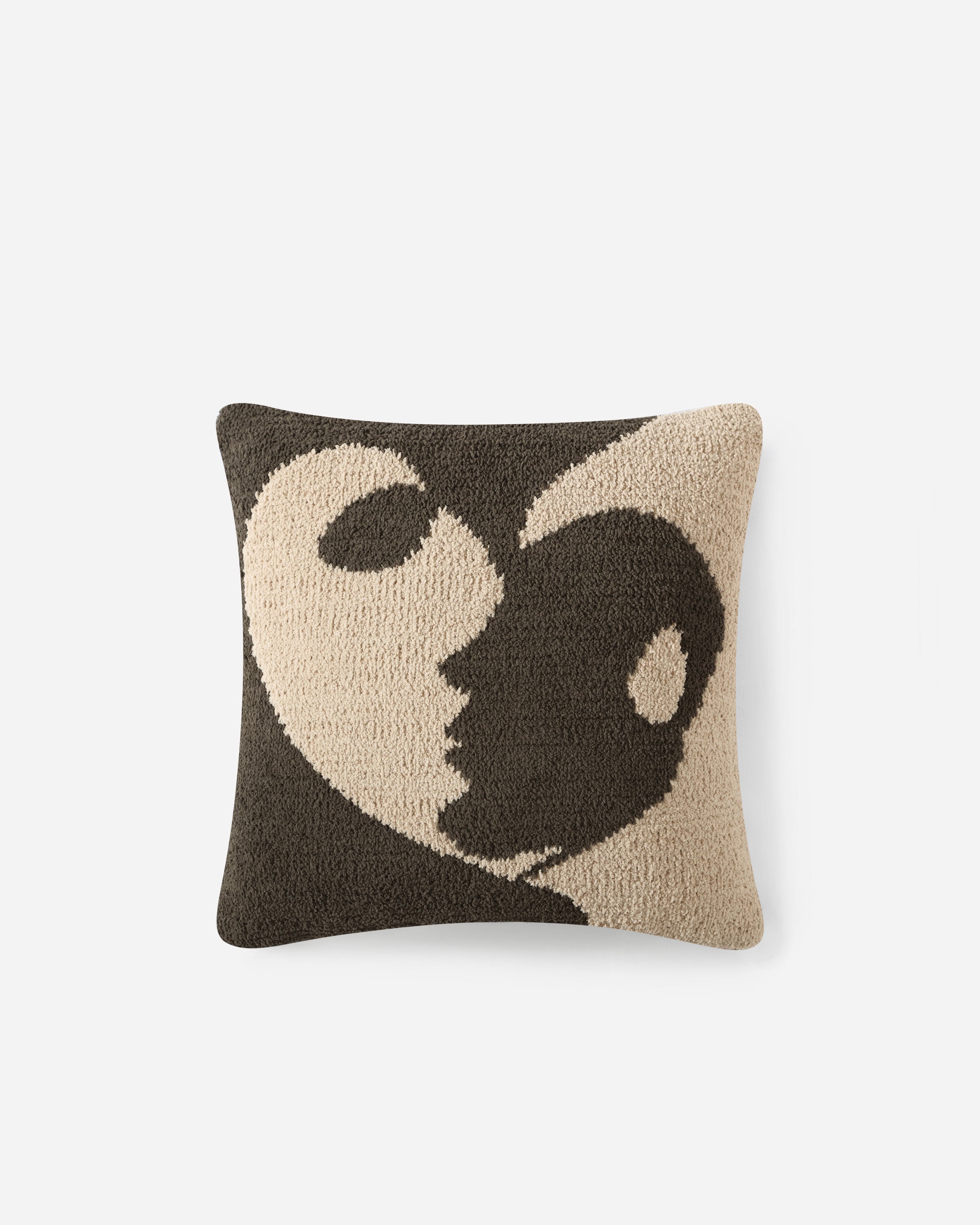 The Faces II Throw Pillow by Sunday Citizen showcases an abstract profile of a face within a heart-like shape. Light and dark brown hues form an optical illusion on a pure white backdrop, and the memory foam filling provides unparalleled comfort. It is OEKO-TEX® certified for quality and safety.
