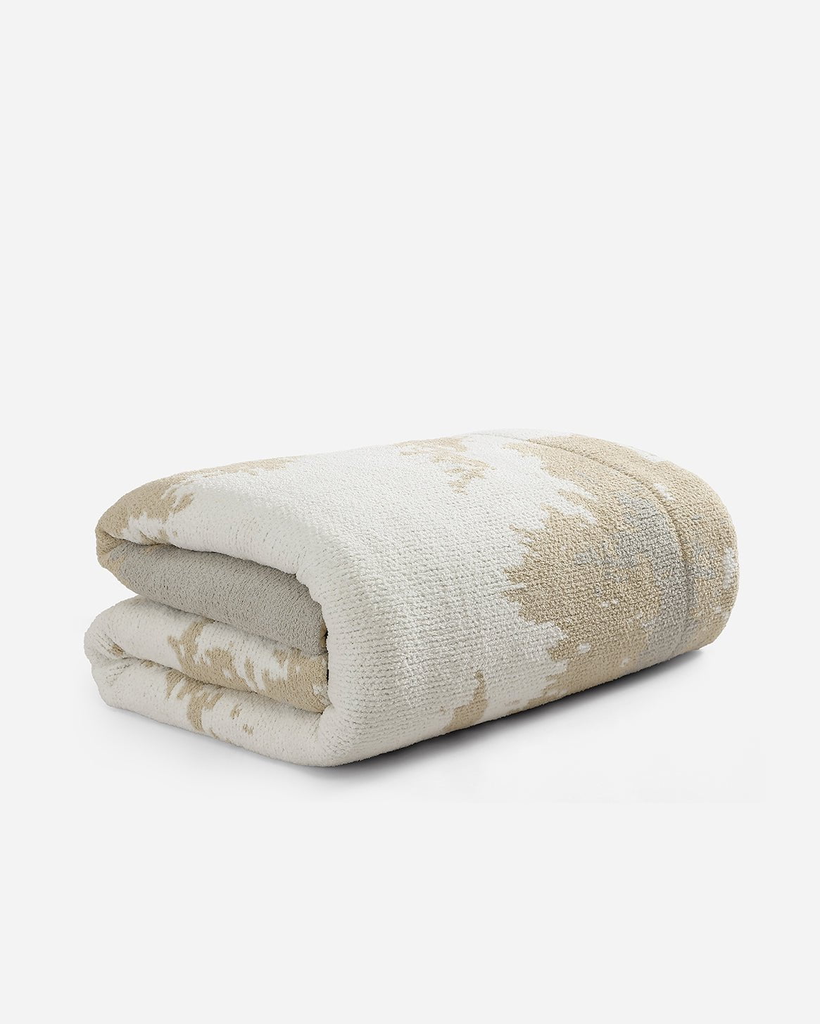 A folded Double Snug Pixel Comforter by Sunday Citizen, featuring a beige and white pattern on a white background. The snug fabric gives it a textured, plush appearance with a subtle abstract design. This all-in-one comforter is crafted with recycled plastic filling for added eco-friendly warmth and comfort.