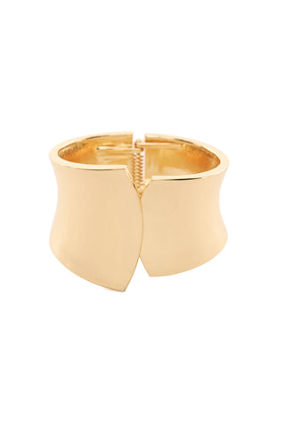 The Zoe Overlap Bangle - Gold is a wide, polished gold-tone cuff bracelet with a sleek, smooth surface and a subtle front opening. Its minimalist design showcases soft curves and a reflective finish, offering an elegant and contemporary appearance.